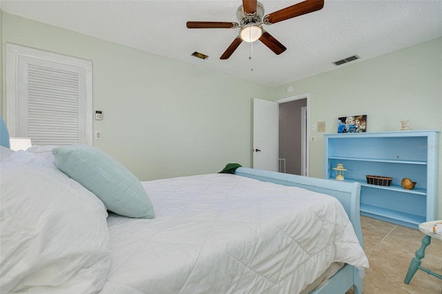 1913 Libby Ct, Holiday, FL 34690 - bedroom with a ceiling fan and light tile patterned floors