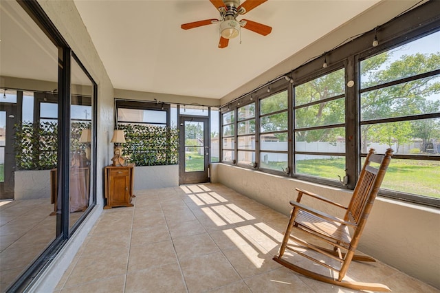 1913 Libby Ct, Holiday, FL 34690 - unfurnished sunroom featuring tile patterned floors and a ceiling fan
