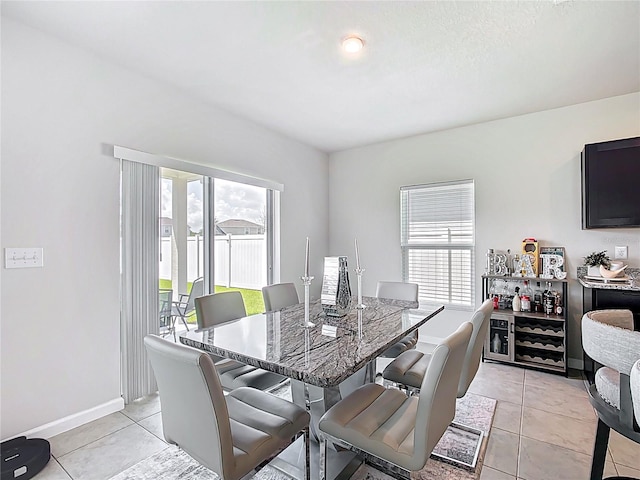 1508 Majestic Ln, Winter Haven, FL 33880 - dining room with light tile patterned flooring and baseboards
