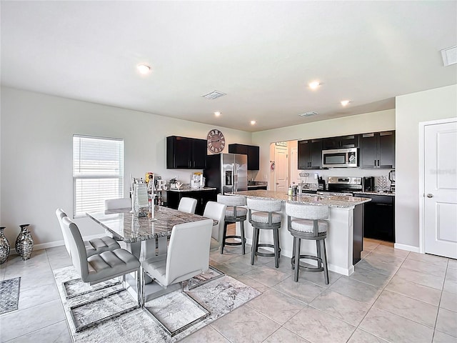 1508 Majestic Ln, Winter Haven, FL 33880 - dining space featuring baseboards, light tile patterned flooring, and recessed lighting