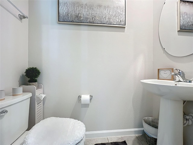 1508 Majestic Ln, Winter Haven, FL 33880 - bathroom featuring toilet, a sink, and baseboards