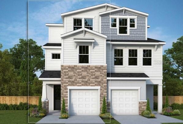 503 W Warren Ave Unit 1, Tampa, FL 33624 - view of front facade with stone siding, a garage, concrete driveway, and roof with shingles