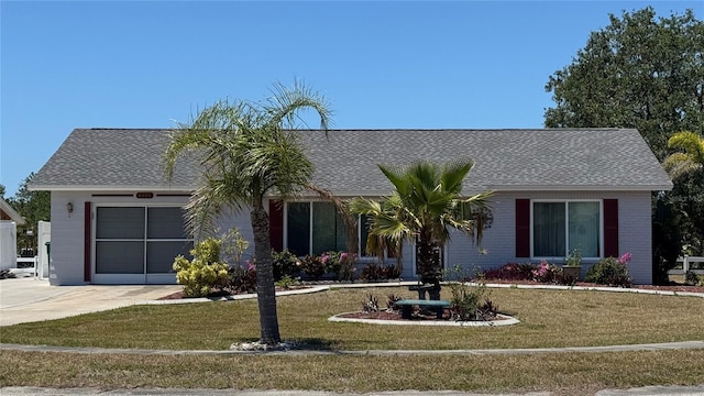 6405 Klaus Ct, Port Charlotte, FL 33981 - view of front of home featuring driveway, an attached garage, a front yard, and a shingled roof
