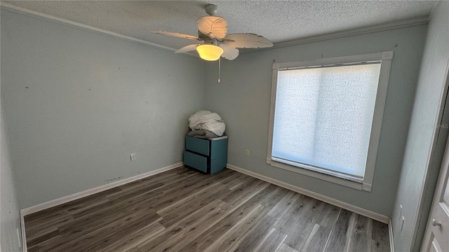 6405 Klaus Ct, Port Charlotte, FL 33981 - unfurnished room featuring wood finished floors, a textured ceiling, baseboards, and ceiling fan