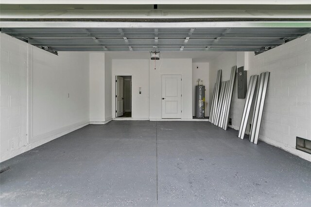 18773 Lake Worth Blvd, Port Charlotte, FL 33948 - garage with water heater, concrete block wall, electric panel, and a garage door opener