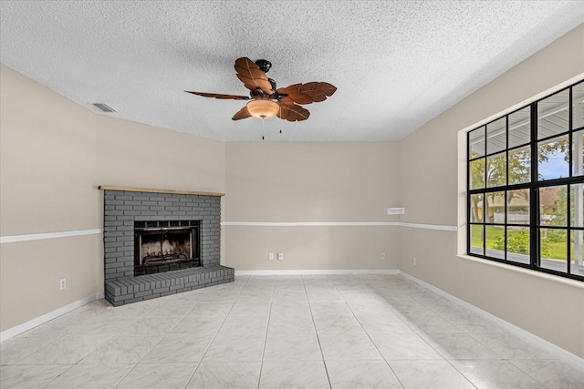 3331 Lime Tree Dr, Edgewater, FL 32141 - unfurnished living room with a textured ceiling, ceiling fan, a brick fireplace, and baseboards