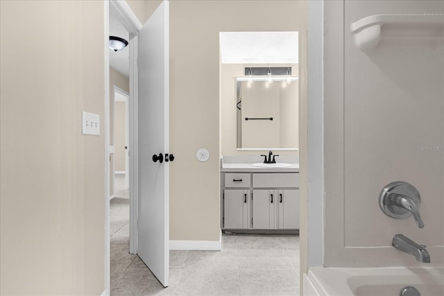 3331 Lime Tree Dr, Edgewater, FL 32141 - bathroom with tile patterned flooring, vanity, shower / washtub combination, and baseboards