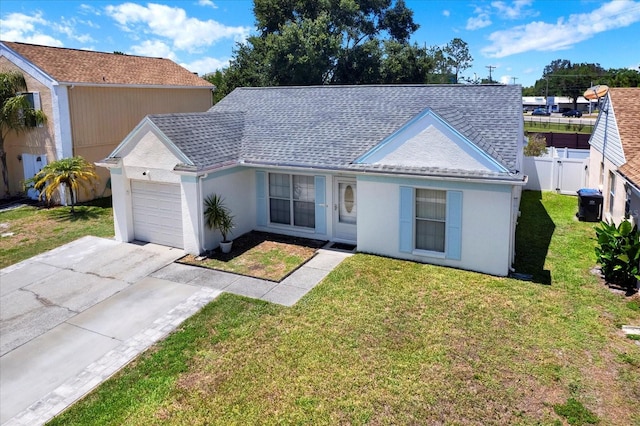 4307 Shadberry Dr, Tampa, FL 33624 - ranch-style house with a garage, concrete driveway, roof with shingles, and stucco siding