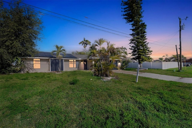 910 SE 23rd Pl, Cape Coral, FL 33990 - view of front of home with solar panels, driveway, and stucco siding