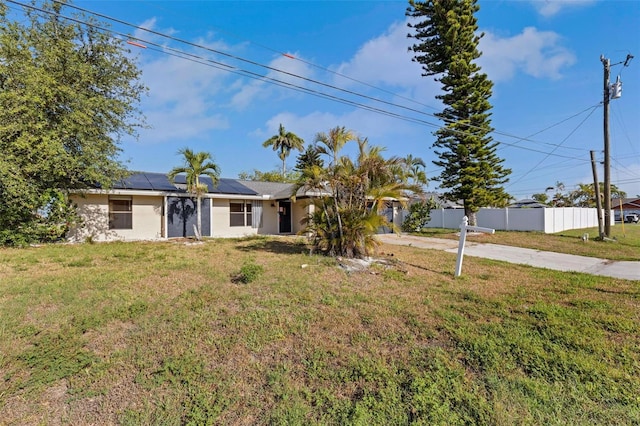 910 SE 23rd Pl, Cape Coral, FL 33990 - ranch-style home featuring driveway, roof mounted solar panels, and stucco siding