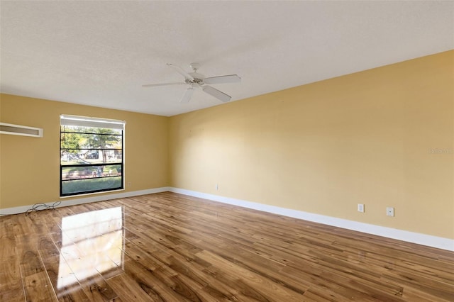 910 SE 23rd Pl, Cape Coral, FL 33990 - unfurnished room featuring wood finished floors and baseboards