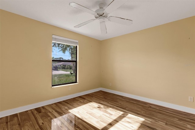 910 SE 23rd Pl, Cape Coral, FL 33990 - spare room featuring wood finished floors, baseboards, and ceiling fan