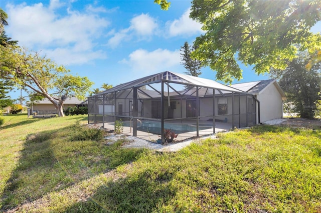 910 SE 23rd Pl, Cape Coral, FL 33990 - swimming pool with a yard, a patio, and a lanai