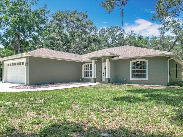 1199 E Mckinley St, Hernando, FL 34442 - single story home featuring a garage, stucco siding, a front lawn, concrete driveway, and roof with shingles