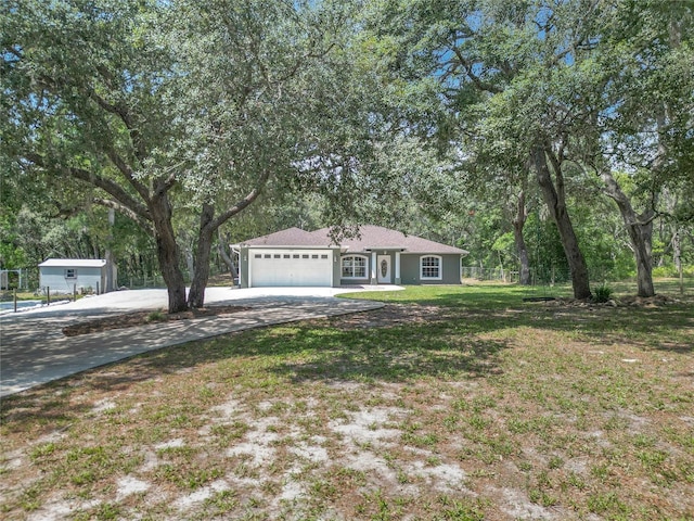 1199 E Mckinley St, Hernando, FL 34442 - single story home featuring concrete driveway, an attached garage, and view of wooded area