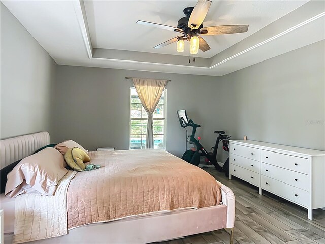 1199 E Mckinley St, Hernando, FL 34442 - bedroom with a raised ceiling, wood finished floors, and a ceiling fan