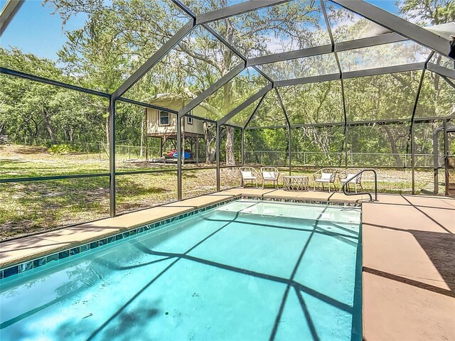 1199 E Mckinley St, Hernando, FL 34442 - outdoor pool with glass enclosure and a patio area