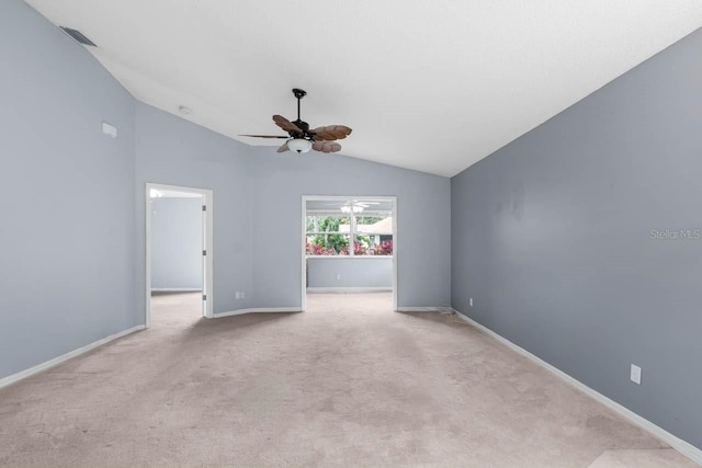 2516 New Haven Cir, Sun City Center, FL 33573 - empty room featuring vaulted ceiling, ceiling fan, carpet, and baseboards