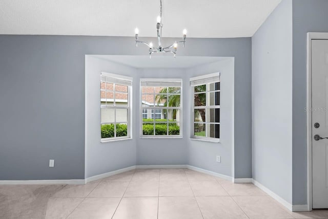 2516 New Haven Cir, Sun City Center, FL 33573 - unfurnished dining area featuring a chandelier, baseboards, and tile patterned floors
