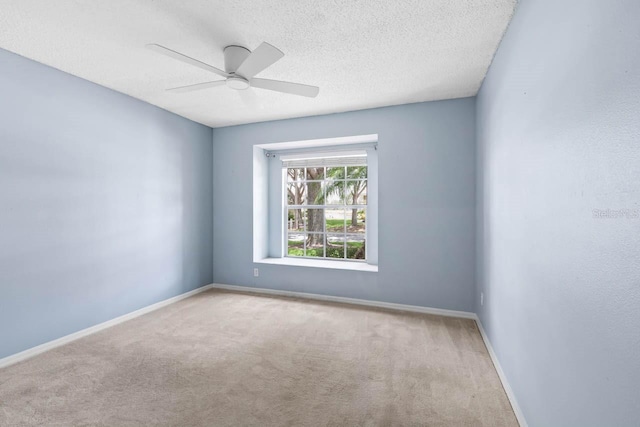 2516 New Haven Cir, Sun City Center, FL 33573 - spare room featuring carpet flooring, a ceiling fan, baseboards, and a textured ceiling