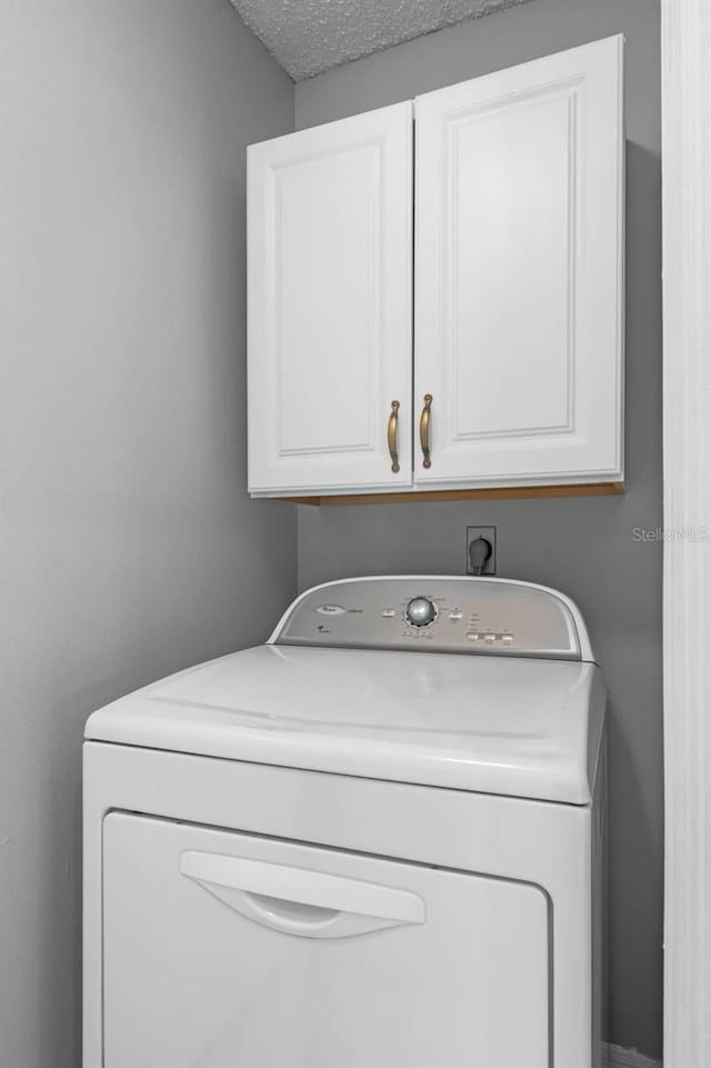 2516 New Haven Cir, Sun City Center, FL 33573 - laundry area featuring washer / dryer and cabinet space
