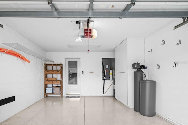 2516 New Haven Cir, Sun City Center, FL 33573 - garage featuring concrete block wall and a garage door opener