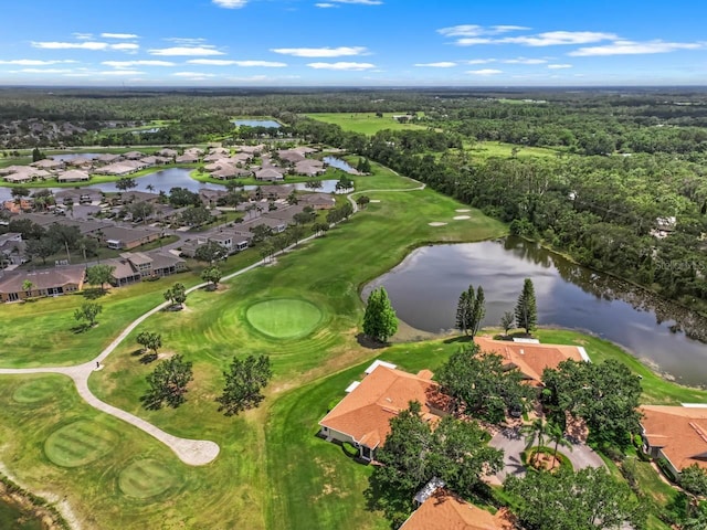 2516 New Haven Cir, Sun City Center, FL 33573 - aerial view of property and surrounding area with a large body of water, nearby suburban area, a golf club, and a heavily wooded area
