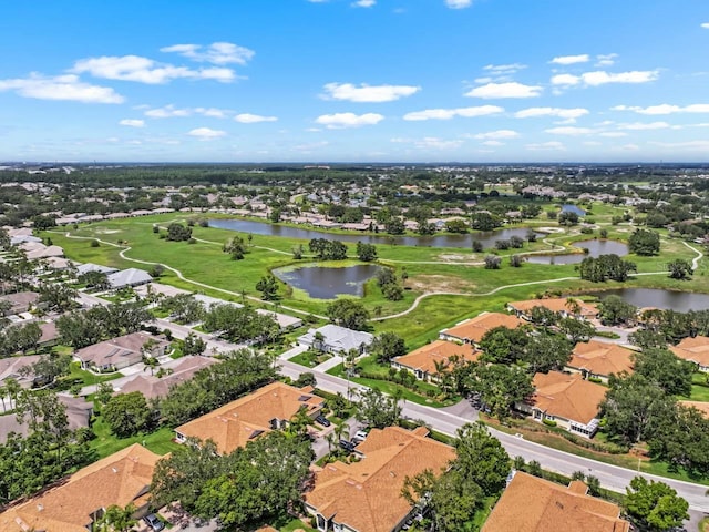 2516 New Haven Cir, Sun City Center, FL 33573 - aerial view of property and surrounding area with a large body of water, nearby suburban area, and a golf club