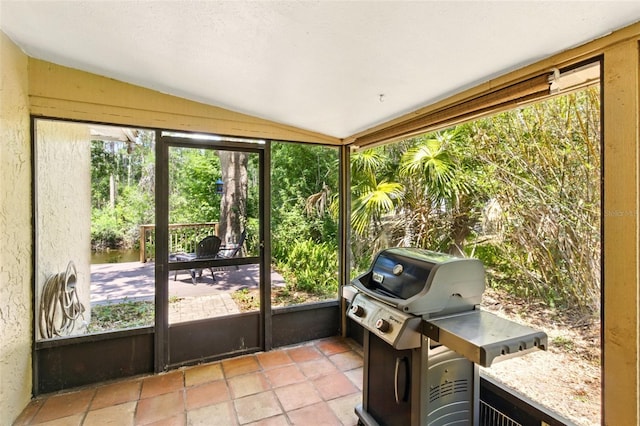 4419 Longshore Dr, Land O Lakes, FL 34639 - sunroom featuring vaulted ceiling and healthy amount of natural light