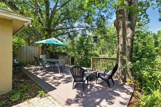 4419 Longshore Dr, Land O Lakes, FL 34639 - wooden deck featuring outdoor dining space
