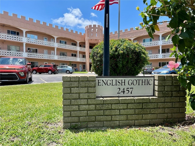 2457 Ecuadorian Way Unit 27, Clearwater, FL 33763 - community sign with uncovered parking and a lawn