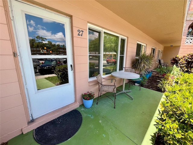 2457 Ecuadorian Way Unit 27, Clearwater, FL 33763 - view of exterior entry with a porch