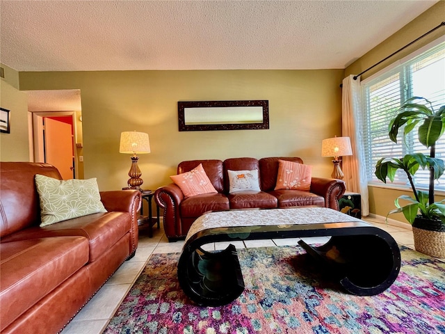 2457 Ecuadorian Way Unit 27, Clearwater, FL 33763 - living area featuring light tile patterned flooring and a textured ceiling