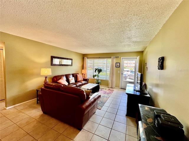 2457 Ecuadorian Way Unit 27, Clearwater, FL 33763 - living room with light tile patterned flooring and a textured ceiling