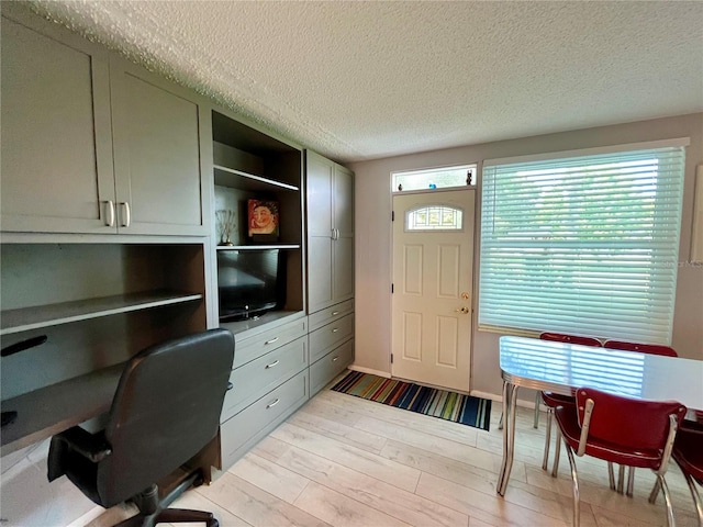 2457 Ecuadorian Way Unit 27, Clearwater, FL 33763 - office featuring a textured ceiling and light wood finished floors