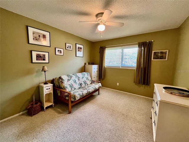 2457 Ecuadorian Way Unit 27, Clearwater, FL 33763 - living area featuring a ceiling fan, carpet, a textured ceiling, and baseboards