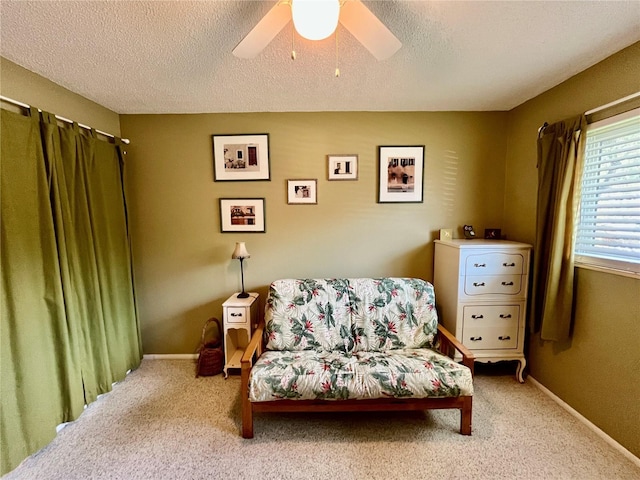 2457 Ecuadorian Way Unit 27, Clearwater, FL 33763 - sitting room featuring carpet, ceiling fan, a textured ceiling, and baseboards
