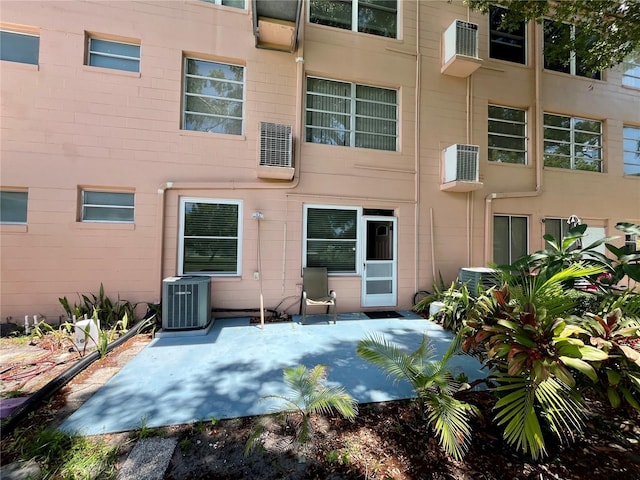 2457 Ecuadorian Way Unit 27, Clearwater, FL 33763 - rear view of property featuring a patio area and central AC unit