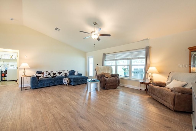 3642 Fantasy Way, Brooksville, FL 34604 - living room with vaulted ceiling, ceiling fan, light wood finished floors, and baseboards