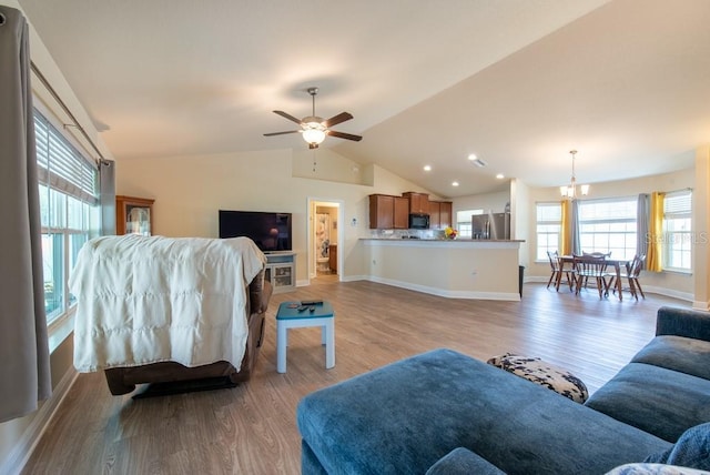 3642 Fantasy Way, Brooksville, FL 34604 - living area with light wood finished floors, lofted ceiling, a chandelier, ceiling fan, and baseboards