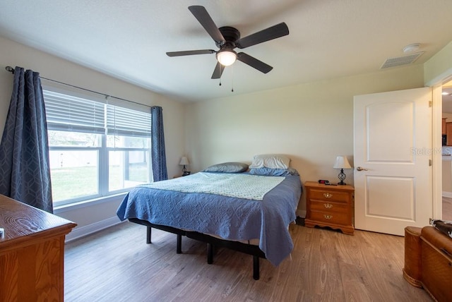 3642 Fantasy Way, Brooksville, FL 34604 - bedroom with light wood finished floors, baseboards, and a ceiling fan