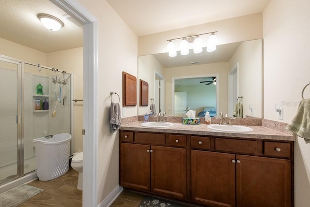 3642 Fantasy Way, Brooksville, FL 34604 - ensuite bathroom with a stall shower, double vanity, ceiling fan, and toilet
