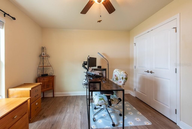 3642 Fantasy Way, Brooksville, FL 34604 - office featuring wood finished floors, a ceiling fan, and baseboards