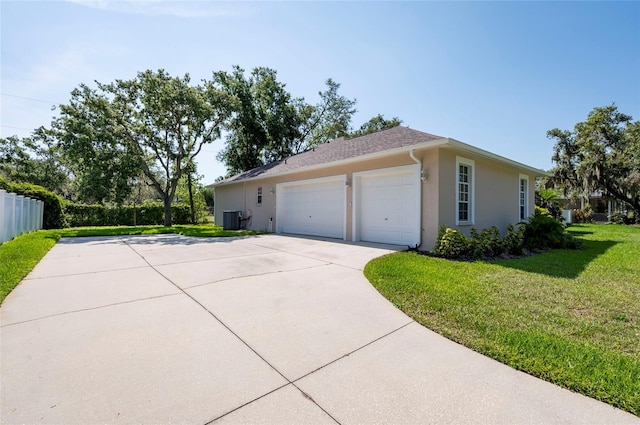 9908 Alafia River Ln, Gibsonton, FL 33534 - view of side of property with stucco siding, cooling unit, and a garage