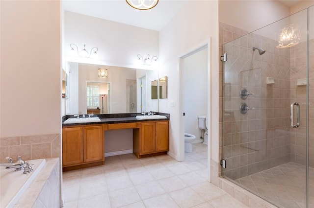 9908 Alafia River Ln, Gibsonton, FL 33534 - full bath featuring a shower stall, double vanity, tile patterned floors, and toilet