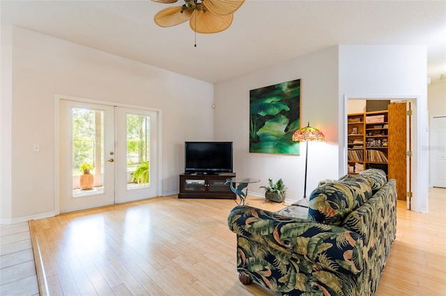 9908 Alafia River Ln, Gibsonton, FL 33534 - living room featuring french doors, ceiling fan, light wood finished floors, and baseboards