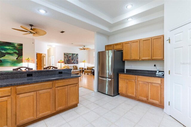 9908 Alafia River Ln, Gibsonton, FL 33534 - kitchen with freestanding refrigerator, a ceiling fan, open floor plan, brown cabinetry, and recessed lighting