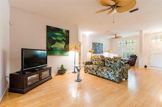9908 Alafia River Ln, Gibsonton, FL 33534 - living room featuring ceiling fan, wood finished floors, and baseboards