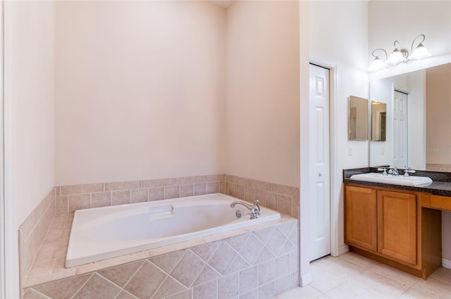 9908 Alafia River Ln, Gibsonton, FL 33534 - bathroom with a garden tub, vanity, and tile patterned flooring