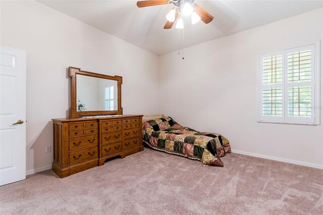9908 Alafia River Ln, Gibsonton, FL 33534 - bedroom featuring multiple windows, carpet, a ceiling fan, and baseboards